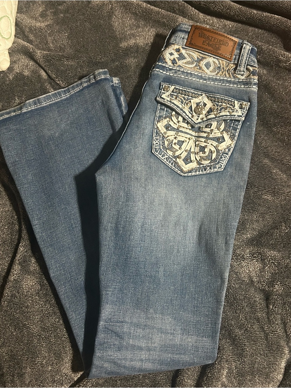 Embroidered Light Blue Bootcut Jeans with Decorative Back Pockets